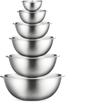 Stacked stainless steel mixing bowls in varying sizes, ideal for baking, cooking, and kitchen storage solutions