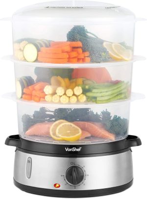 Three-tier food steamer with vegetables, salmon, and lemon slices, ideal for healthy cooking and meal preparation
